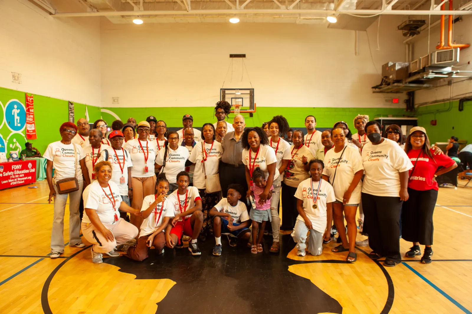The full team of volunteers, partners, and families at the Queens Community Closet launch